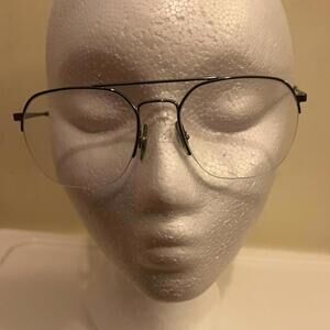 Ray Ban aviator eye glasses. Silver half rim with brown arms. Barely used